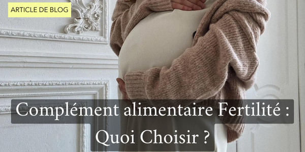 Femme enceinte tenant son ventre pour introduire l'article de blog "complément alimentaire fertilité : quoi choisir ? " 